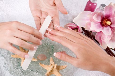 woman getting nails done
