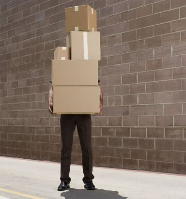 man holding boxes