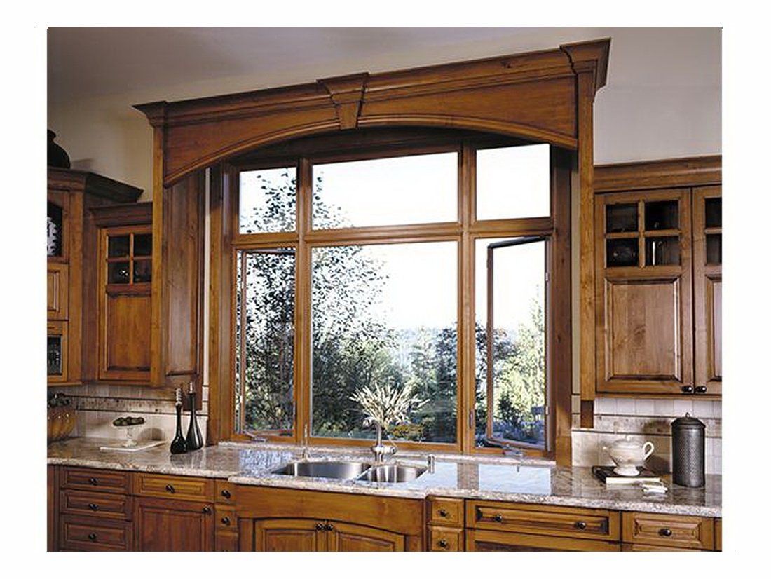 Kitchen with Wood Cabinets Features Windows Above the Sink