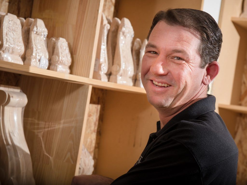 Worker in Crown Moulding Display Area