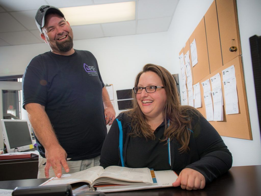 Precision Interior Products' Team Conversing in Office