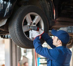 Brake Repair — Car Mechanic Replacing Wheel in Antioch, CA Brake Repair — Car Mechanic Replacing Wheel in Antioch, CA