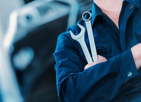 Oil Change — Repairman With Wrench And Ring Spanner in Antioch, CA Oil Change — Repairman With Wrench And Ring Spanner in Antioch, CA
