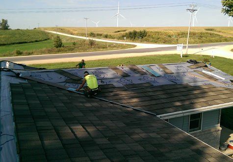 Workers Repairing Roof — Elk Horn, IA — Modern Roofing LLC Workers Repairing Roof — Elk Horn, IA — Modern Roofing LLC