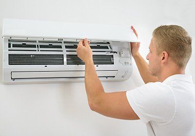 Man checking the HVAC - Plumbing in Berwyn, PA Man checking the HVAC - Plumbing in Berwyn, PA