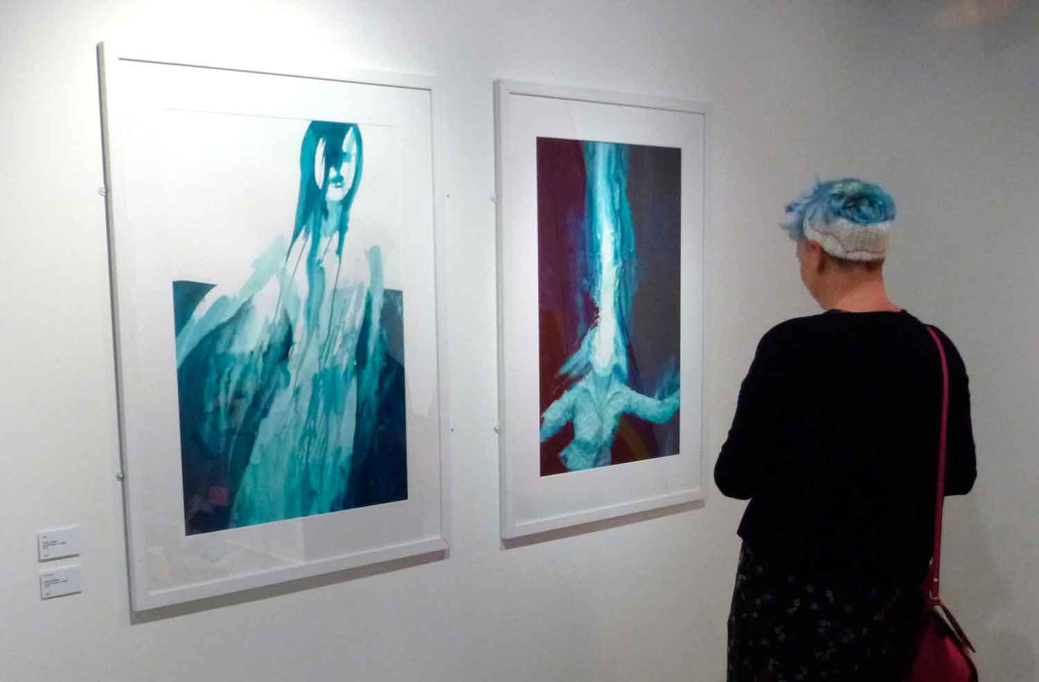 A photo of two paintings by artist Evelyn Sinclair on view at the Cumbria Artist of the Year Show at Rheged in Cumbria., the Lake District.