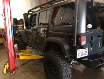 Man repairing a Car — Auto Repair in Cotati, CA Man repairing a Car — Auto Repair in Cotati, CA