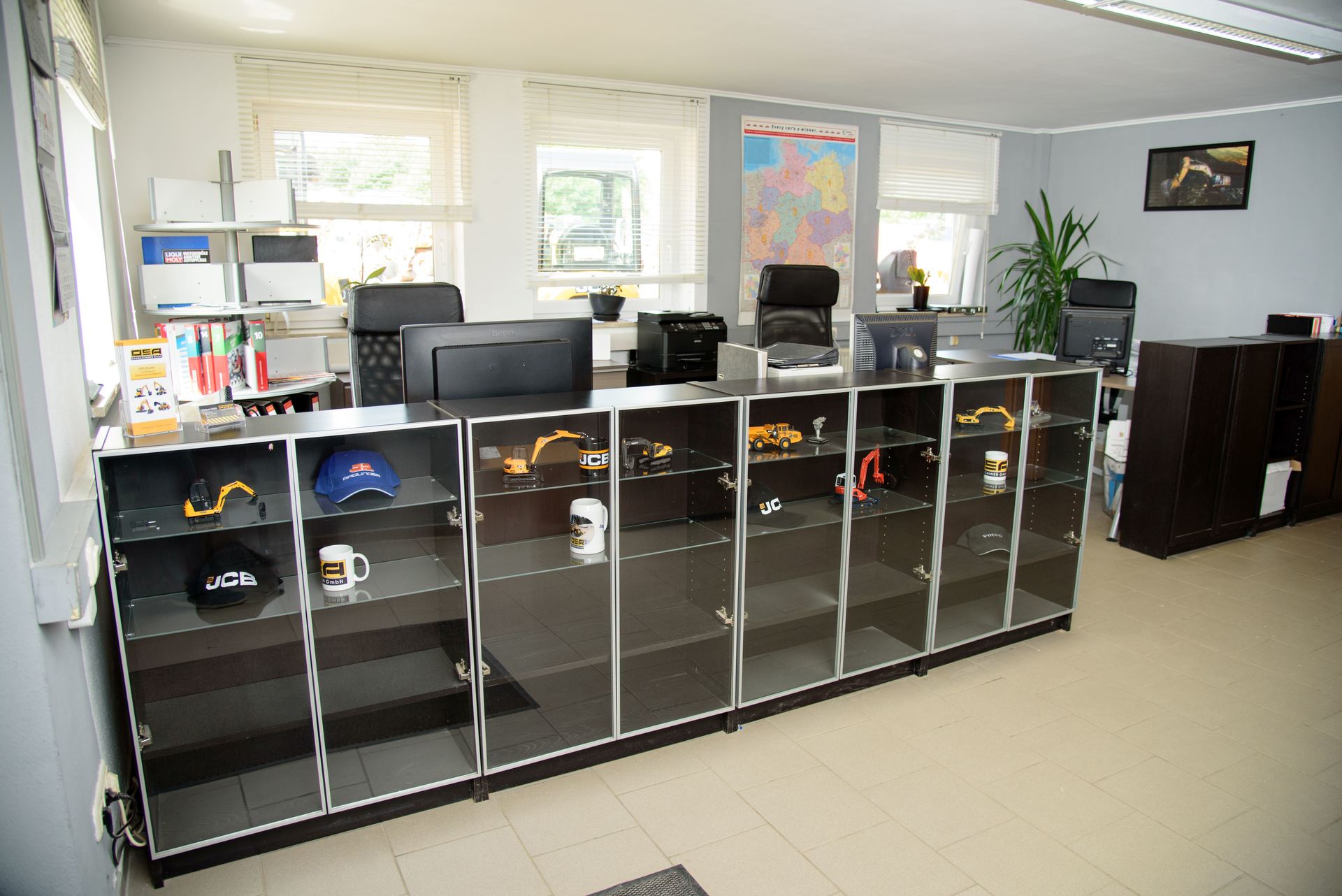 A room with a lot of shelves and a map on the wall.