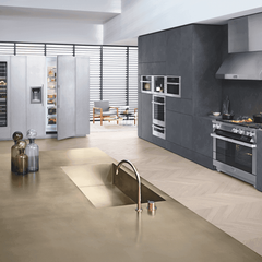 A kitchen with stainless steel appliances and a sink