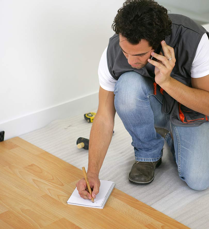 Builders Laying Wooden Floor — Floor Installation in Bundaberg, QLD