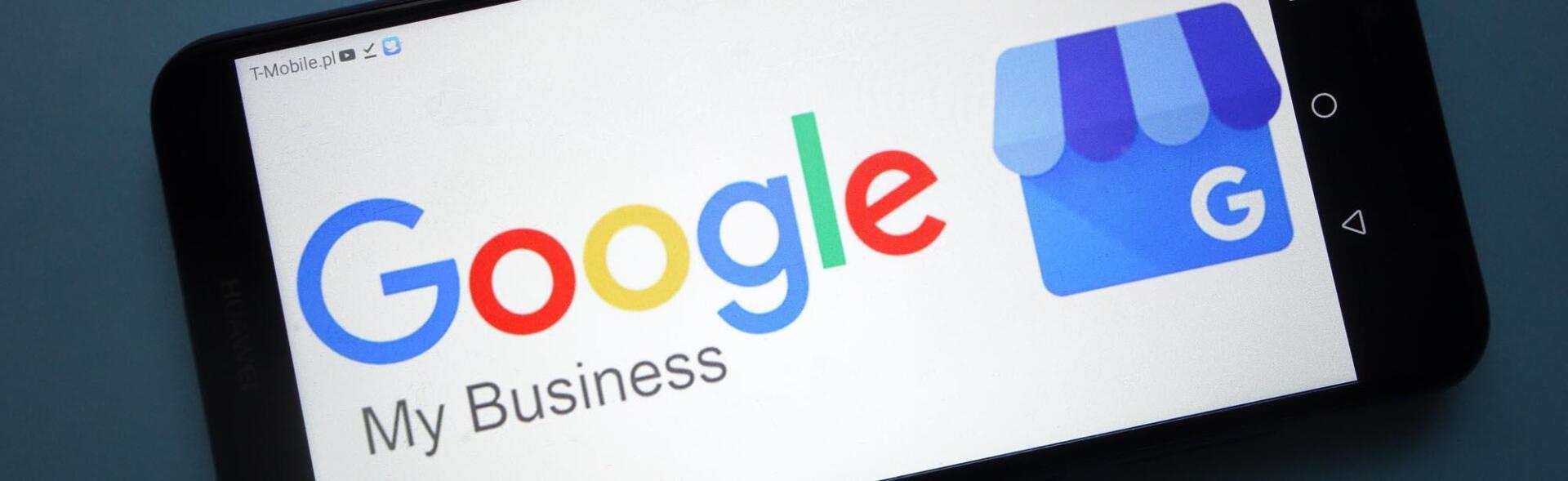 A close up of a google my business logo on a cell phone.