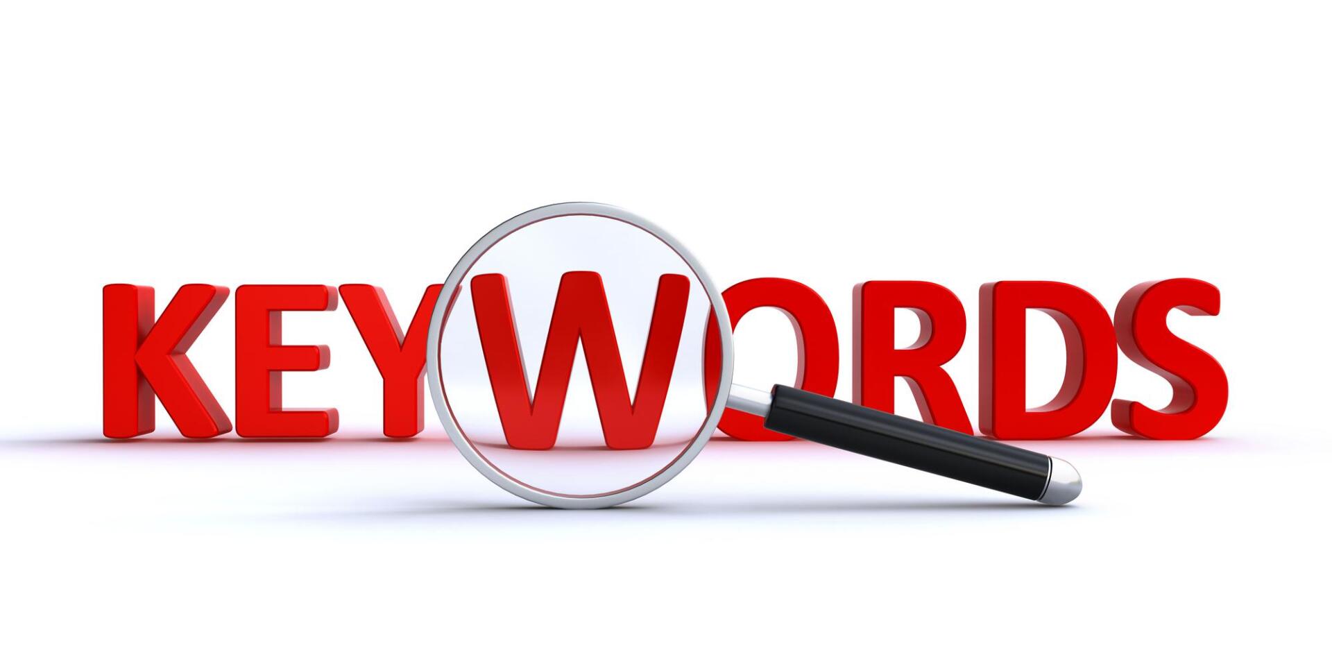 A magnifying glass is looking at the word keywords