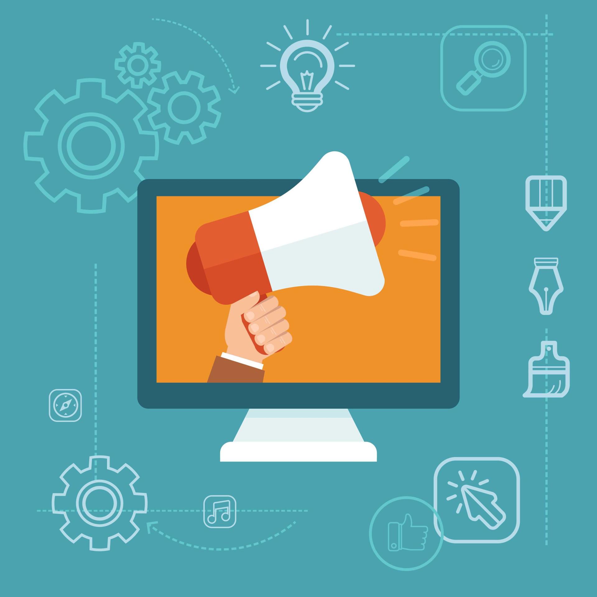 A hand is holding a megaphone in front of a computer screen.