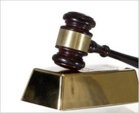 Gavel on gold bar — Stephen J Palopoli Law in Allentown, PA Gavel on gold bar — Stephen J Palopoli Law in Allentown, PA