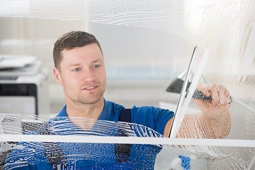 Potomac — Guy Cleaning the Glass in in Rockville, MD Potomac — Guy Cleaning the Glass in in Rockville, MD