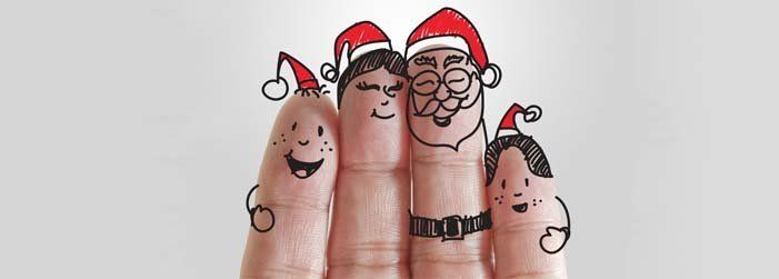 A group of fingers with christmas characters drawn on them.