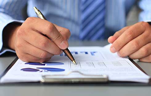 Businessman with Graphs and Charts - Business Taxes in Rancho Cucamonga, CA Businessman with Graphs and Charts - Business Taxes in Rancho Cucamonga, CA