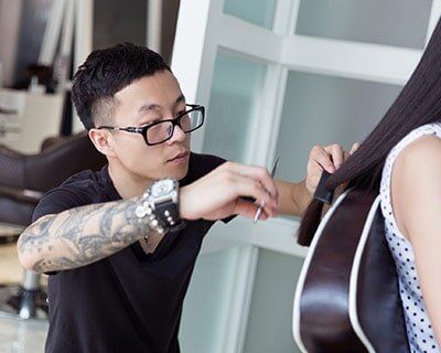 Instructor — Man Cutting Woman's Hair in Washington, DC Instructor — Man Cutting Woman's Hair in Washington, DC