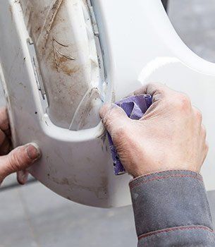 Accident Repair — Worker Repairing Car Part in Griffith, IN Accident Repair — Worker Repairing Car Part in Griffith, IN