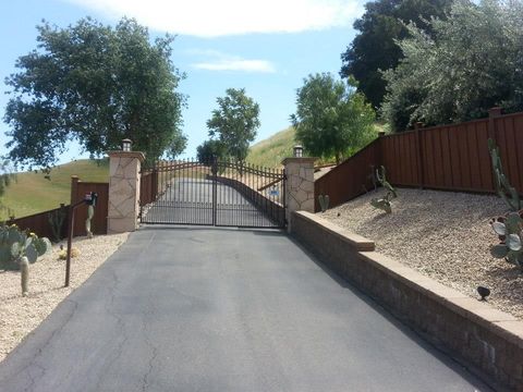 Man Screws Metal Fence — San Leandro, CA — AJR Door Service Man Screws Metal Fence — San Leandro, CA — AJR Door Service