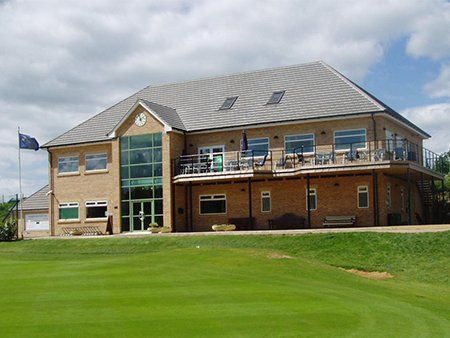 Large two-storey apartment complex situated in a green space