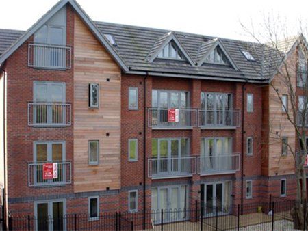 Apartment complex with grey-fronted balconies