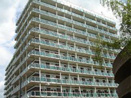 Tall apartment complex with balconies