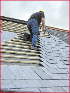 A roofer installing a new roof