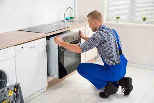 Repairman Repairing Oven – Prompt HVAC & Appliance Service in Plainfield, IL Repairman Repairing Oven – Prompt HVAC & Appliance Service in Plainfield, IL