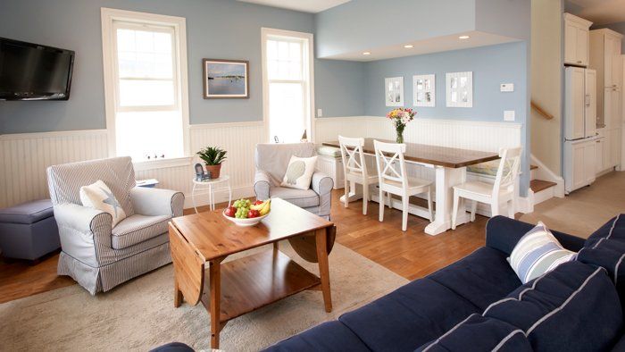 furnished living room with ocean themed blue furniture