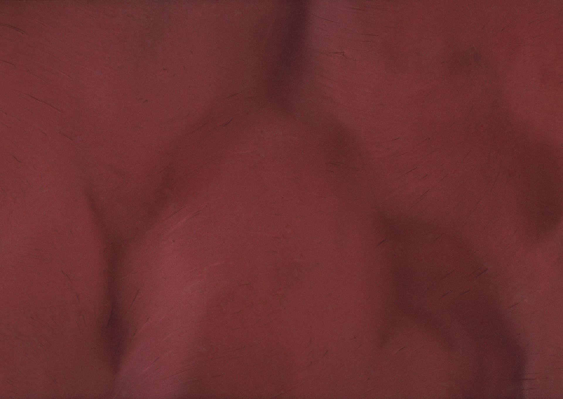 Close-up of a muscular male back, burgundy fabric texture. The person's silhouette is lightly visible.