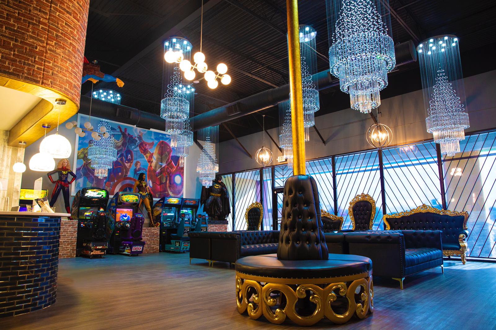 Colorful casino lounge with slot machines, chandeliers, and a decorative fountain in the center