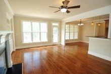 Home interior with large windows and hardwood floors