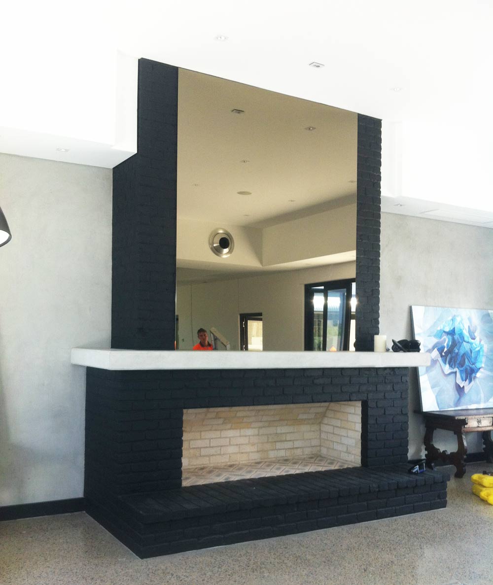 mirror above fireplace