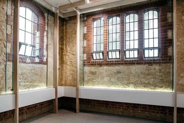grid windows surrounded by brick