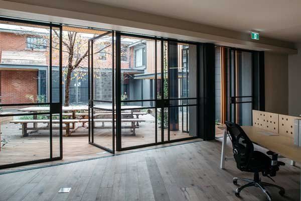 glass door opened to courtyard