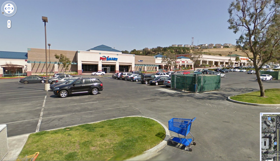 Enclosed HRP Power Unit with Below Ground Cylinder in shopping center parking lot, Signal Hill, California, circa 2002