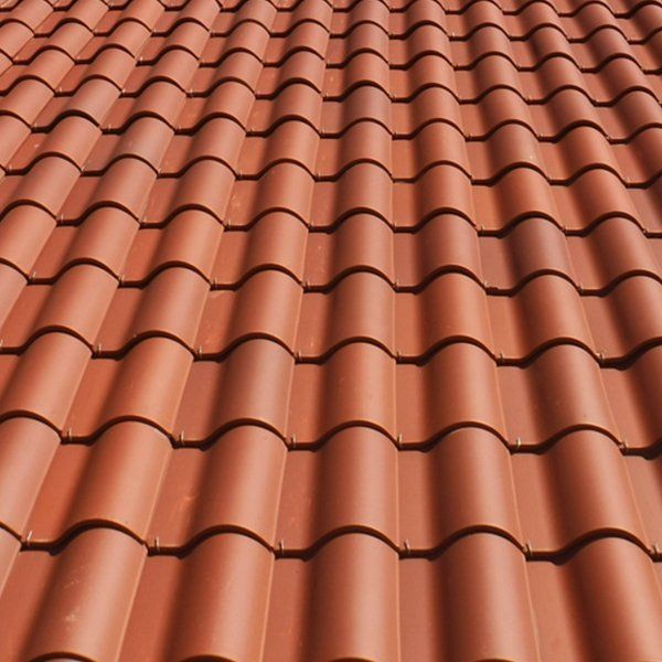 A close up of a red clay tile roof