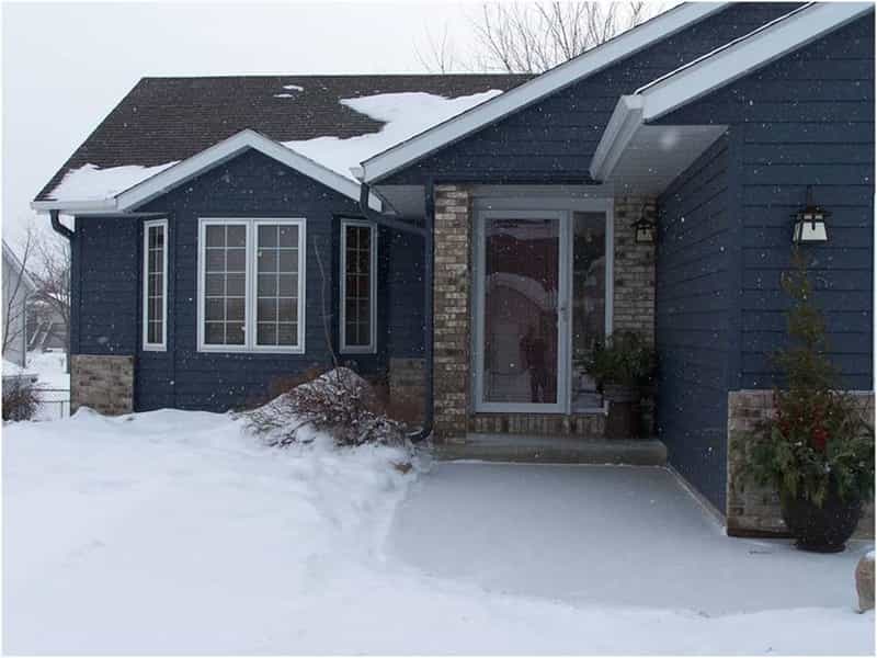 Steel Siding with snow - downspouts in Owatonna Steel Siding with snow - downspouts in Owatonna