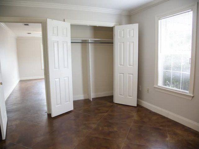 Bedroom with large closet and window