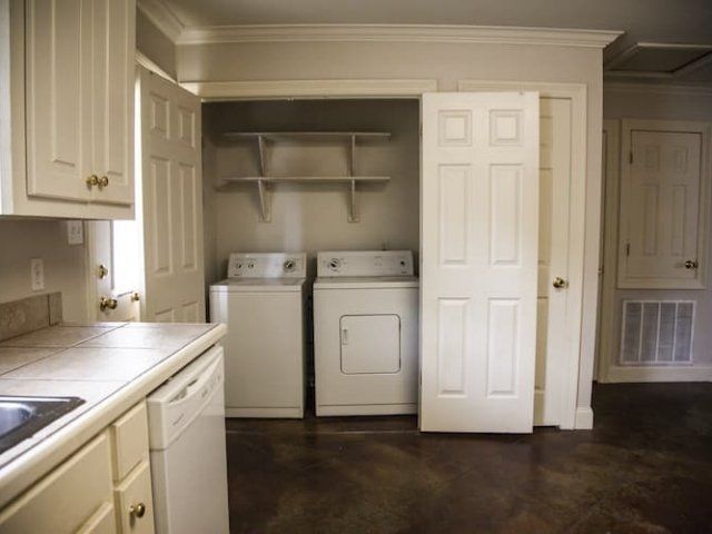 Laundry closet with appliances in kitchen