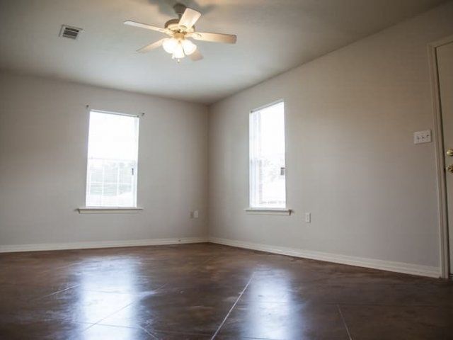 Living room with tile floor and ceiling fan