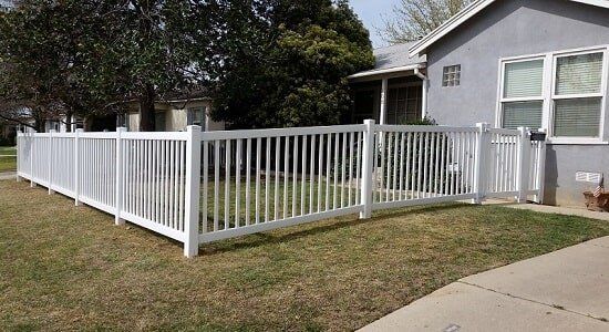 Beautiful house with wood fence gate — Wood Fences in Bakersfield, CA Beautiful house with wood fence gate — Wood Fences in Bakersfield, CA