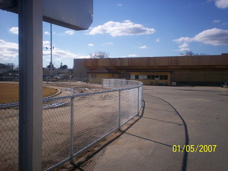 Chainlink fence in road — Wood Fences in Bakersfield, CA