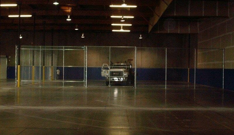 Chainlink fence in parking lot — Wood Fences in Bakersfield, CA