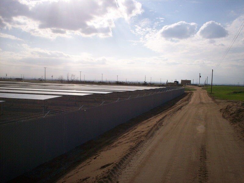 Roadway with chainlink fence — Wood Fences in Bakersfield, CA