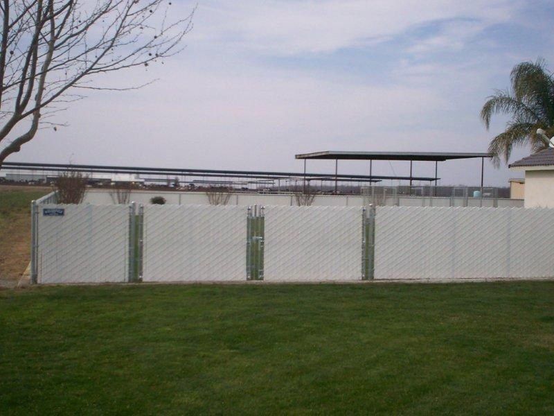 Wood fence in grass — Wood Fences in Bakersfield, CA