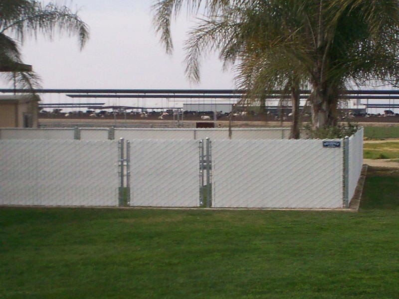 Wood fence in grass field — Wood Fences in Bakersfield, CA