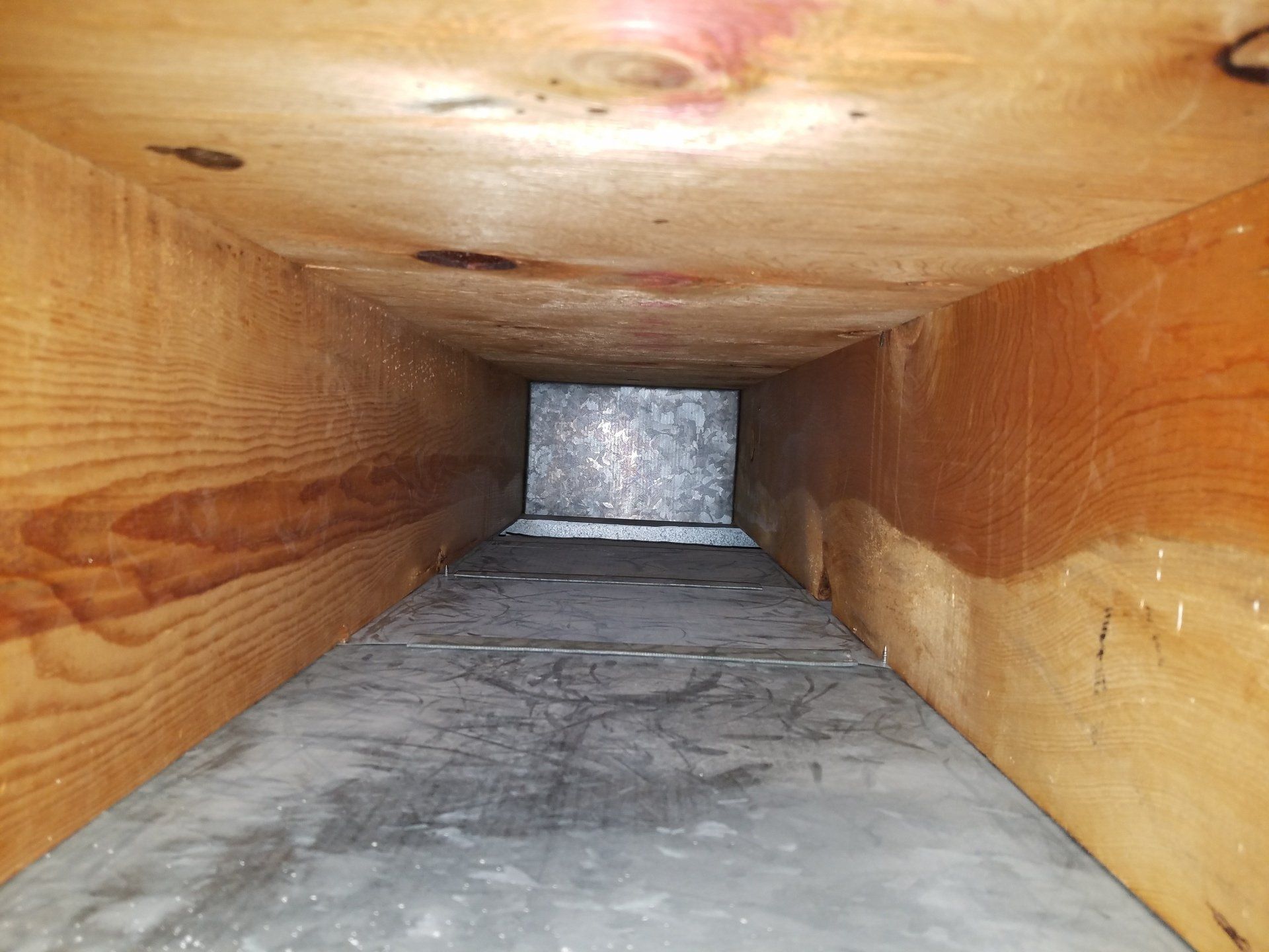 Duct Cleaning — Man Cleaning Floor Heating Vent in Rapid City, SD Duct Cleaning — Man Cleaning Floor Heating Vent in Rapid City, SD