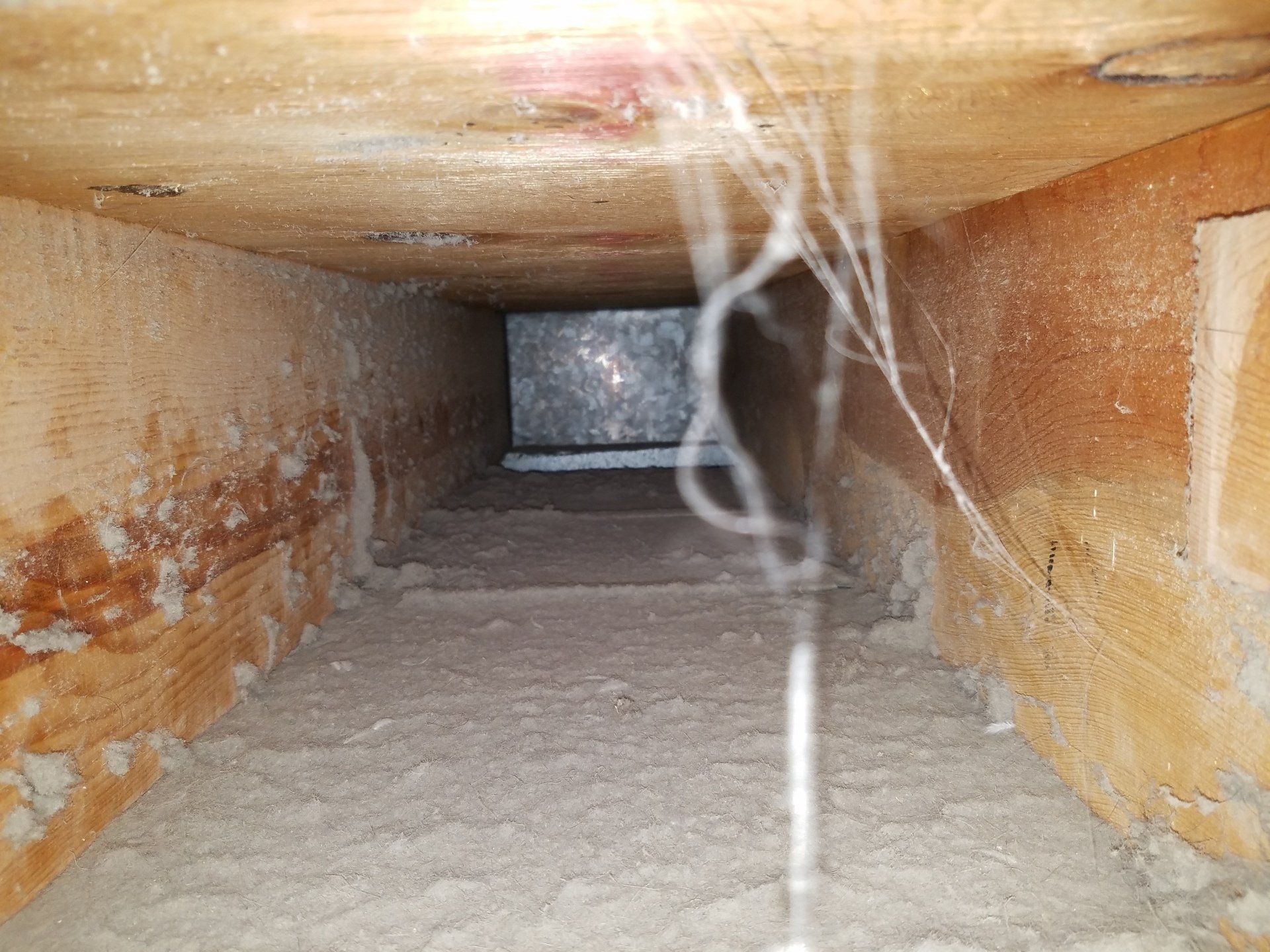Duct Cleaning — Man Cleaning Floor Heating Vent in Rapid City, SD Duct Cleaning — Man Cleaning Floor Heating Vent in Rapid City, SD